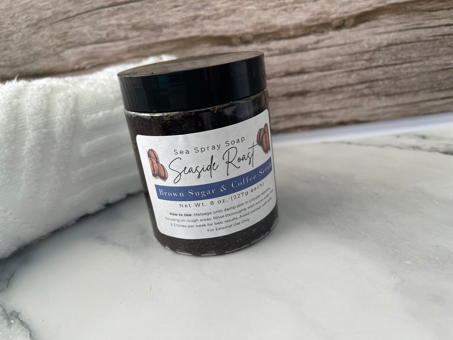 Jar of Sea Spray Soap with Seaside Roast label on a marble surface