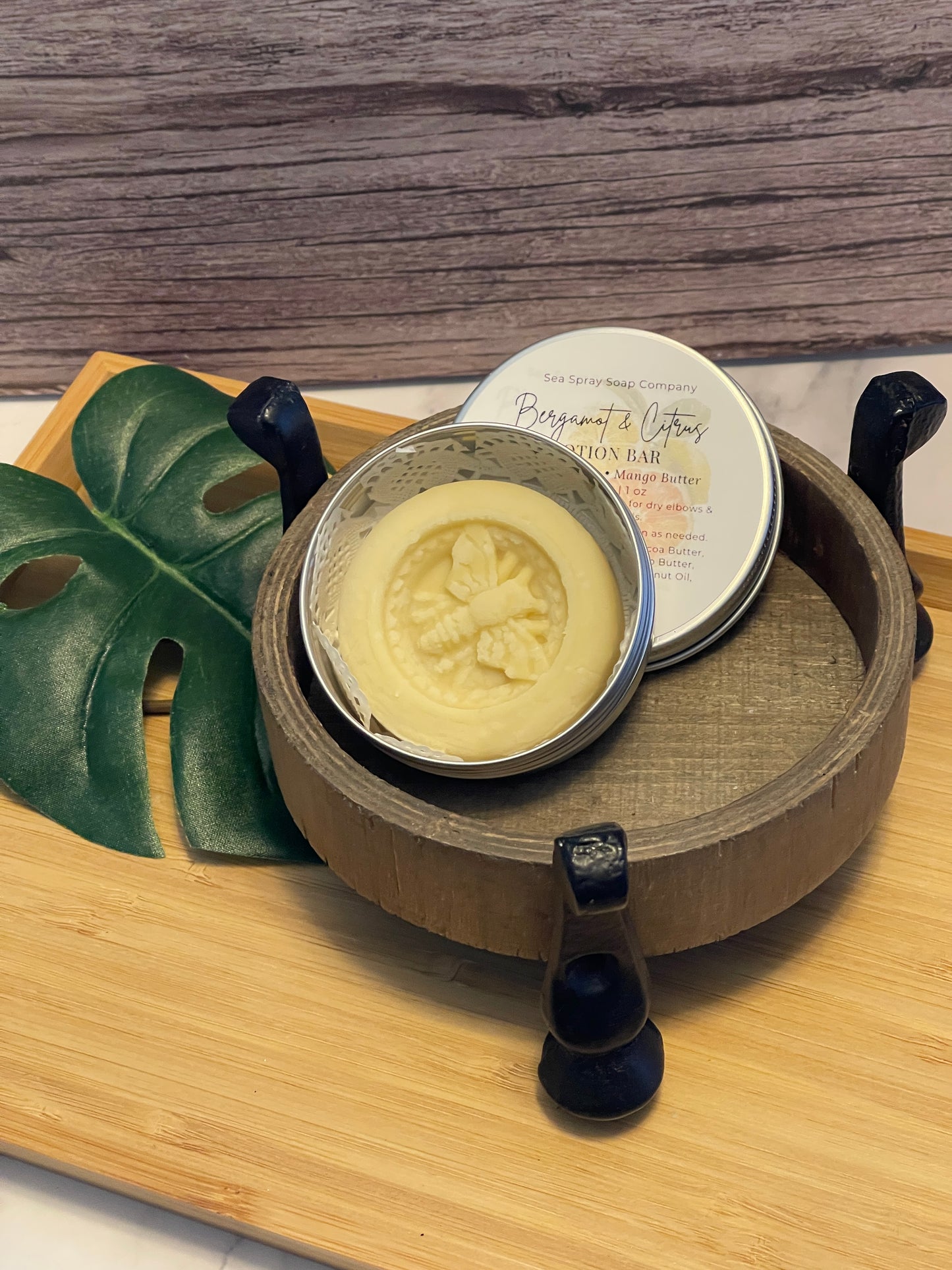 Tea bag with a decorative label on a wooden surface