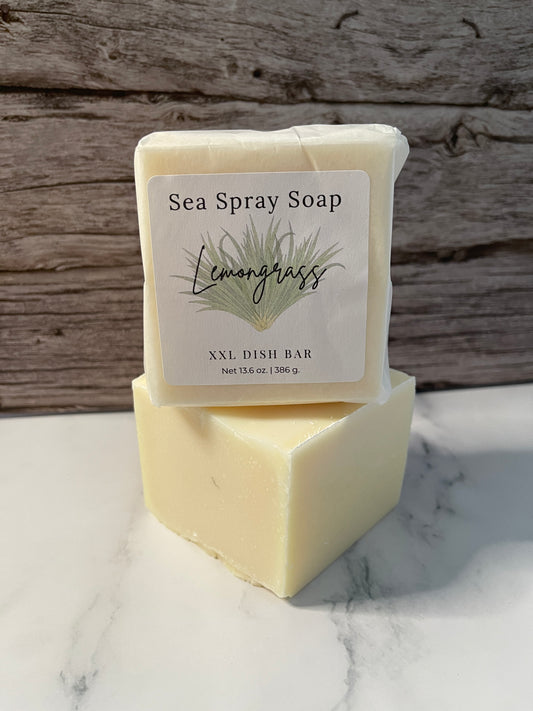 Bar of soap with a label on a wooden and marble surface