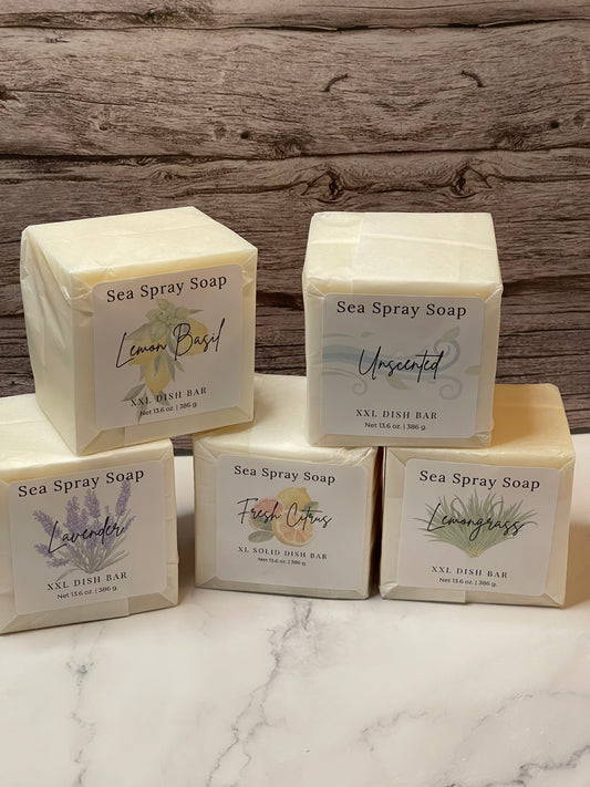 Sea Spray Soap bars with labels on a wooden and marble surface