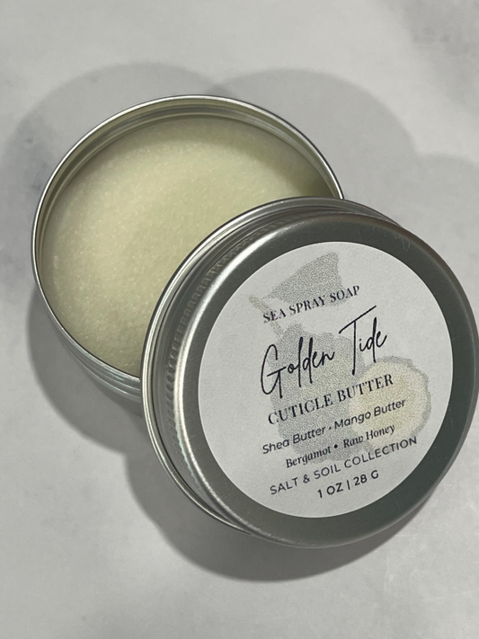 Cuticle butter in a metal tin with a label on a light gray background