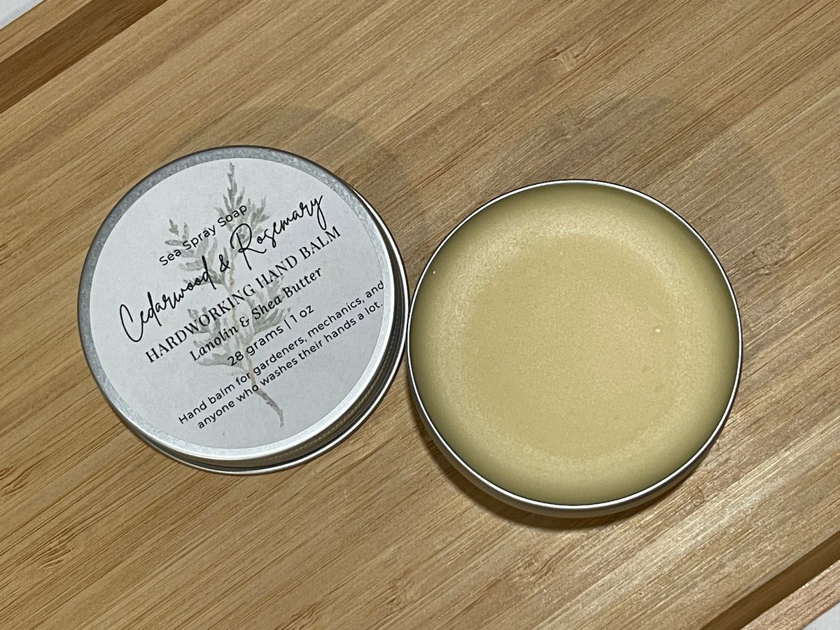 Hardworking Hand Balm open tin with the lid next to it. 