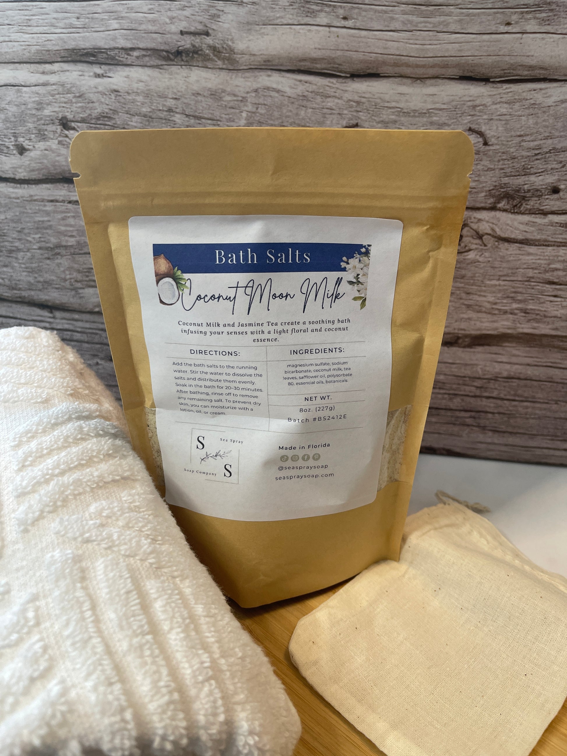 Bath salts packaging with a label on a wooden surface