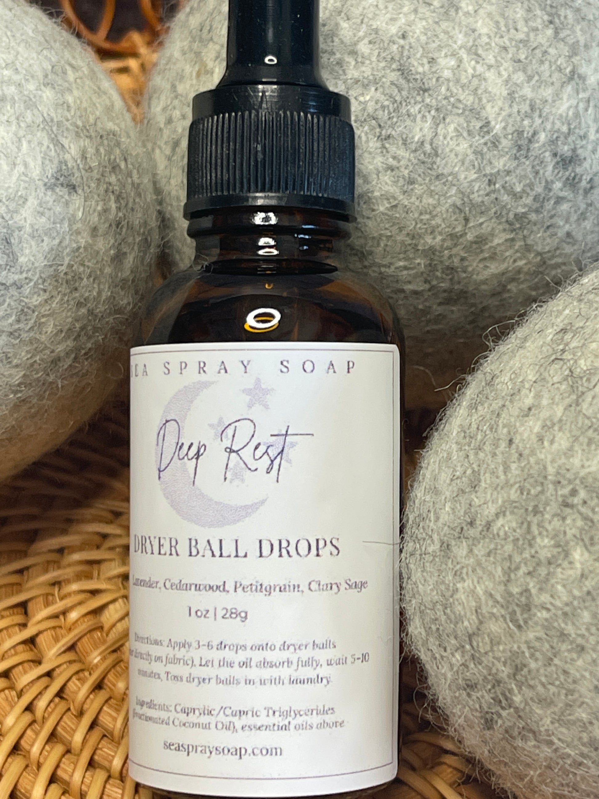Bottle of Deep Rest River Ball Drops spray soap on a textured surface