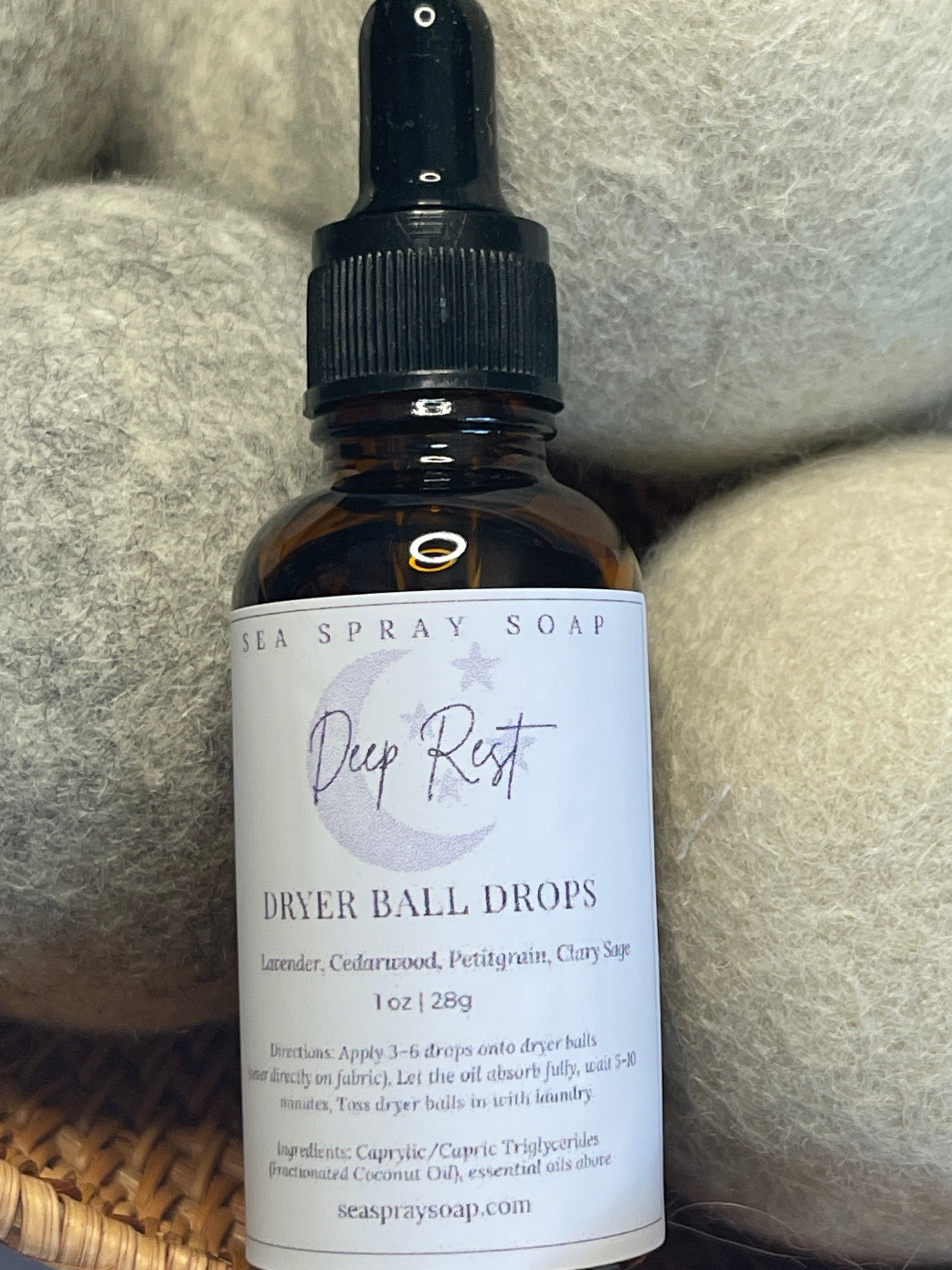 Bottle of Deep Rest Dever Ball Drops with a label on a textured surface