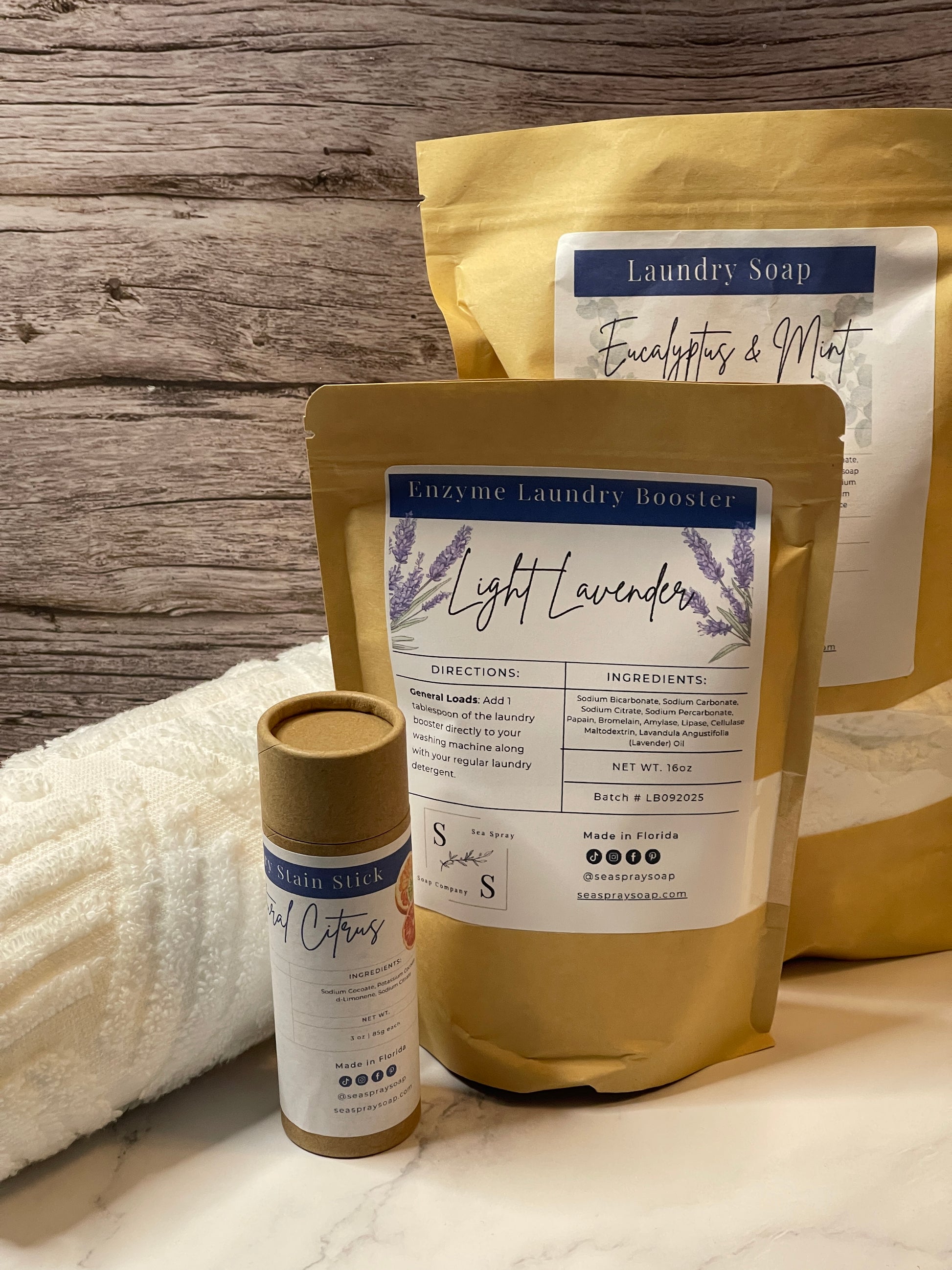 Two packages of 'Light Lavender' with a bottle on a wooden surface.