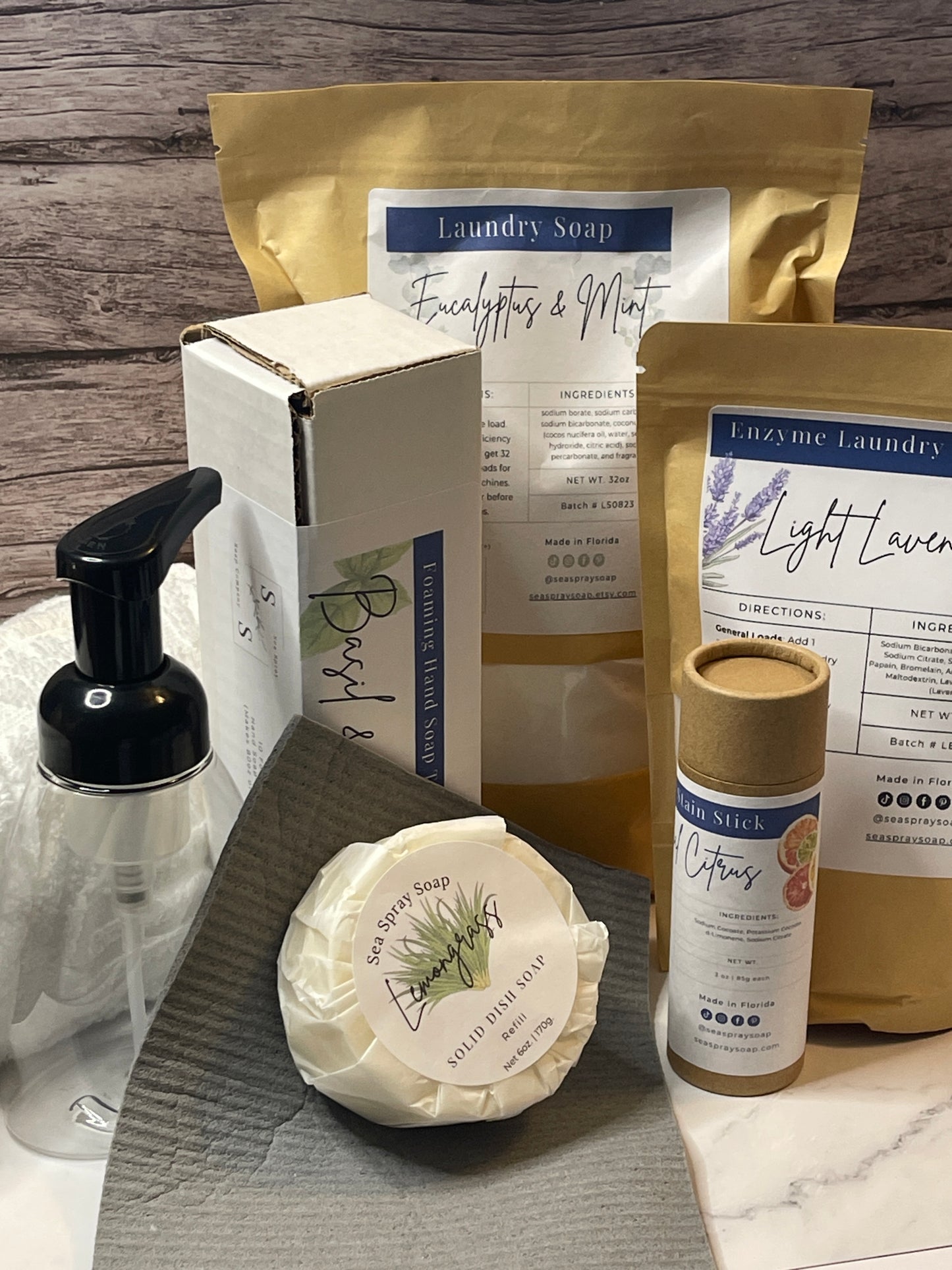 Assorted natural products including soap and packaging on a wooden surface