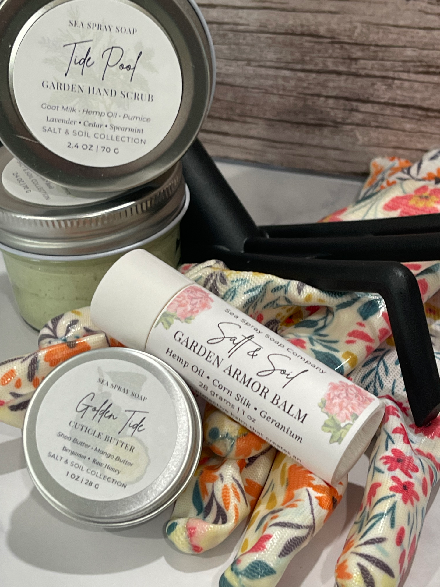 Balm containers with floral patterned cloth on a wooden surface
