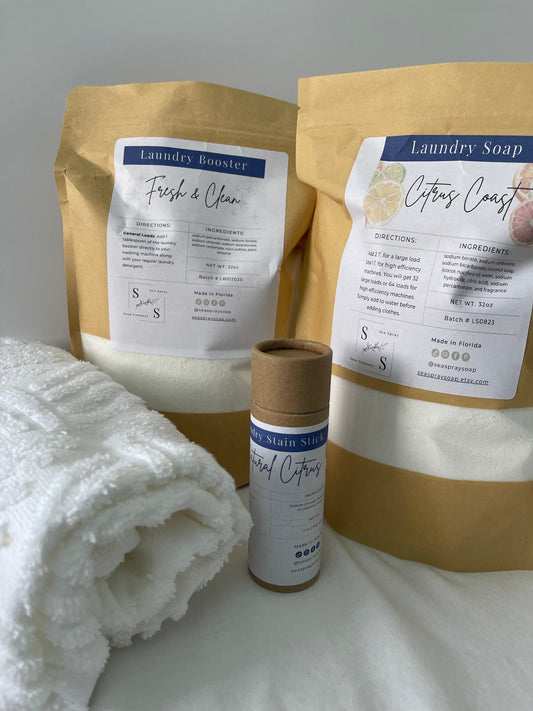 Laundry soap packages and a towel on a white background