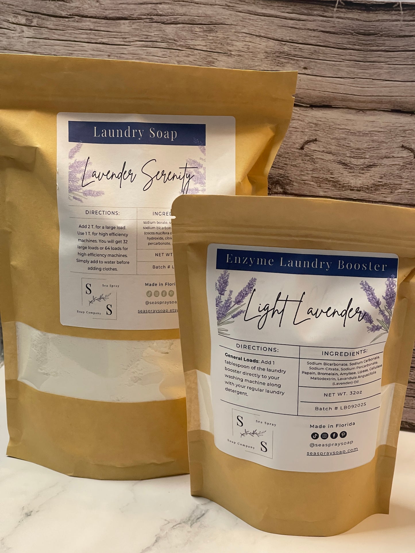 Two packages of Lavender Laundry Soap with labels on a wooden surface.