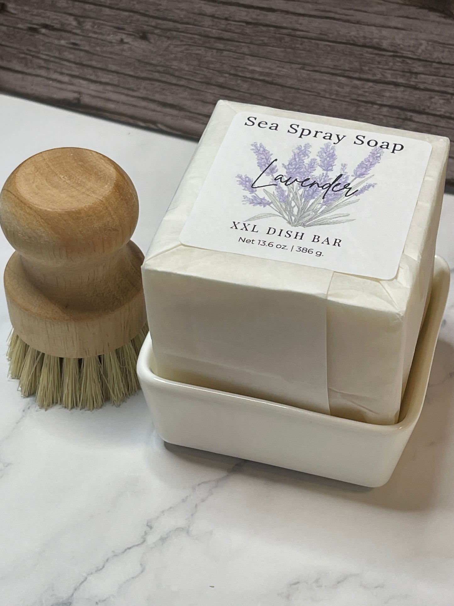 Sea Spary Soap lavender dish bar with a wooden brush on a marble surface