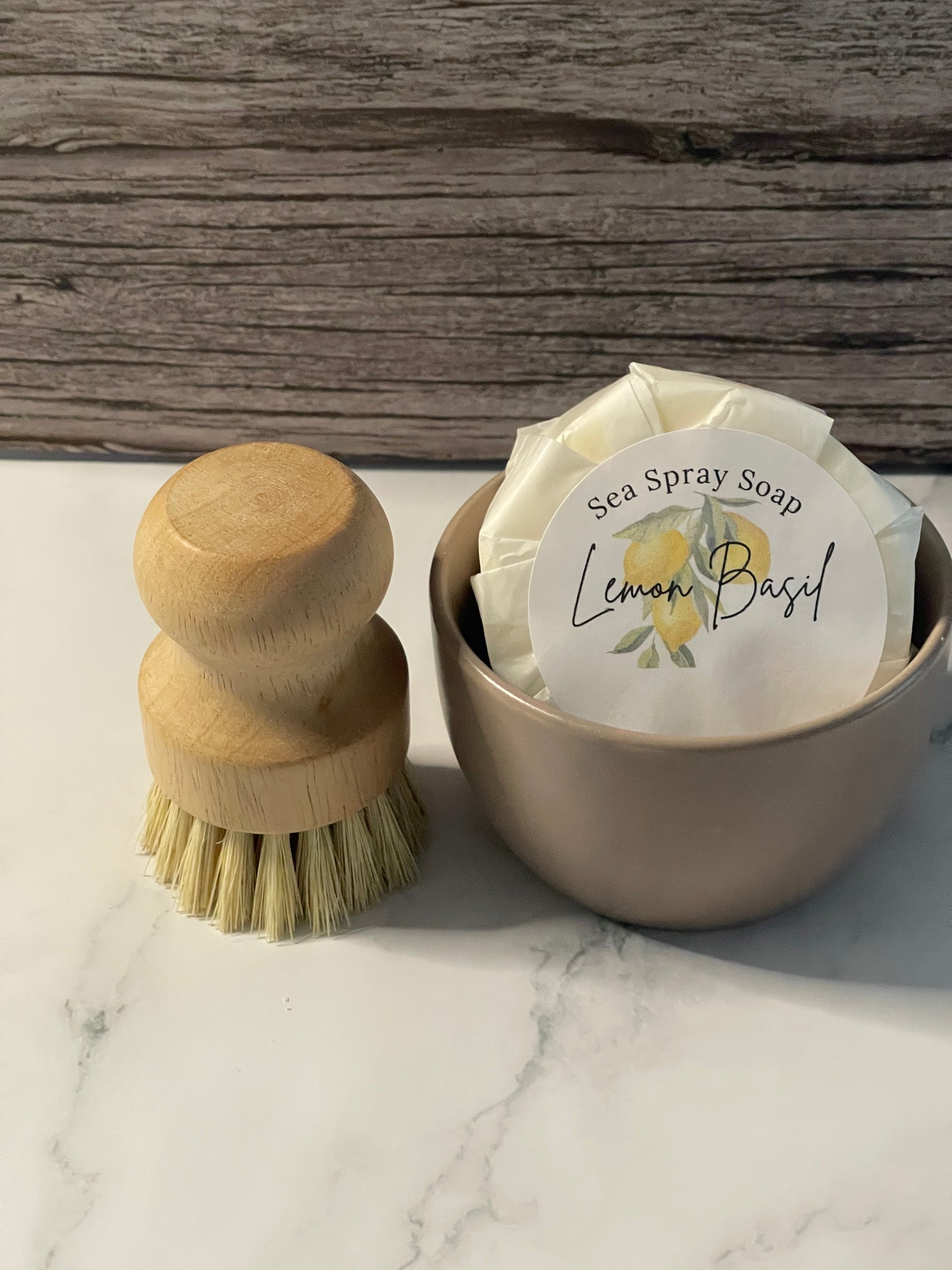 Sea spray soap with a wooden brush on a marble surface