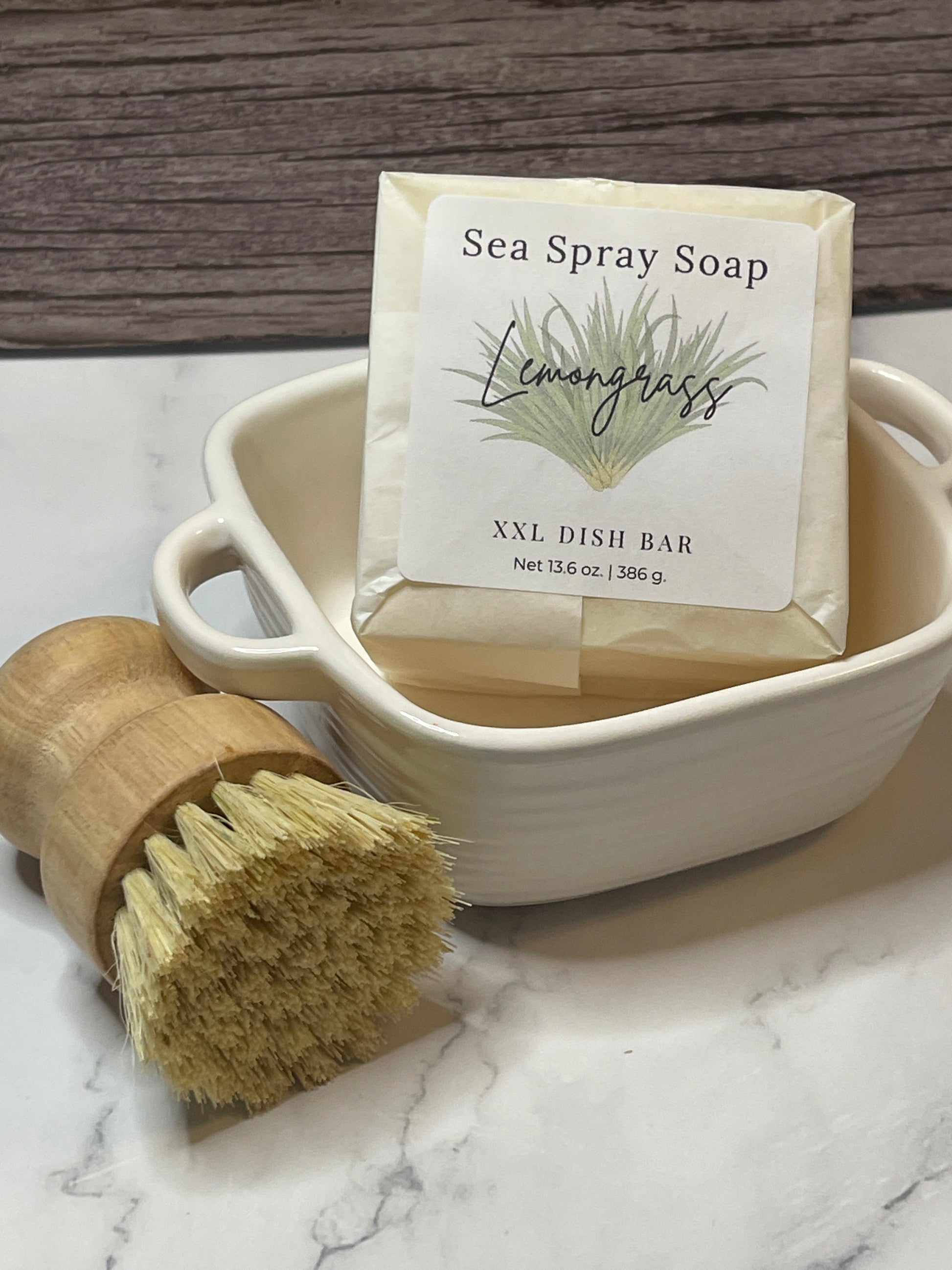 Sea Spray Soap bar with a wooden dish brush on a marble surface