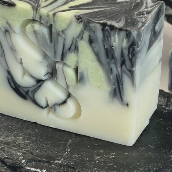 charcoal-clay-clarifying-soap-bar-on-grey-soap-dish