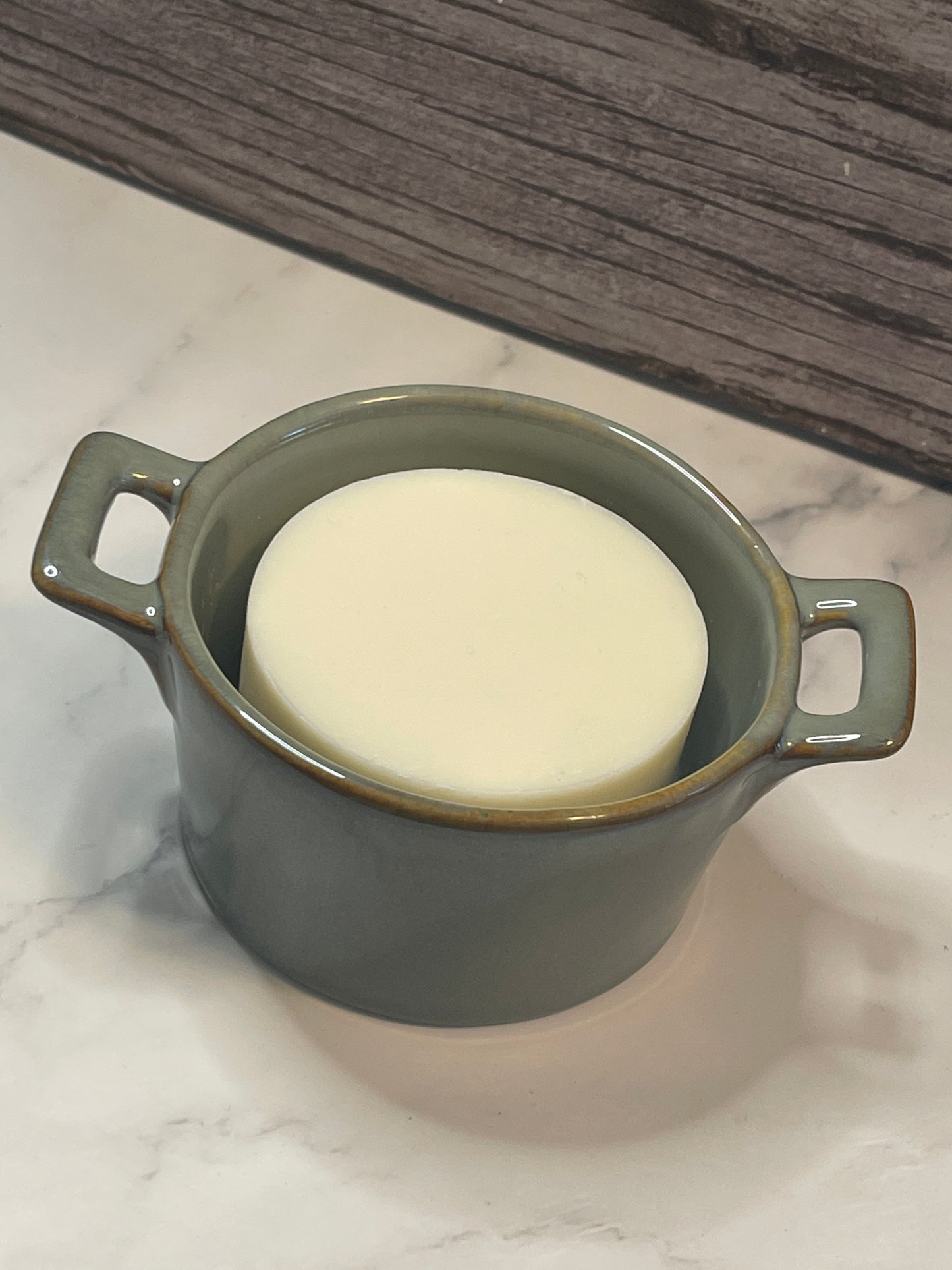 ceramic dish with handles and solid dish soap refill.