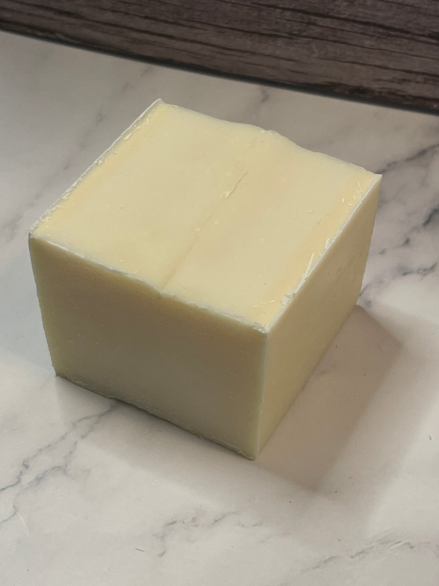 solid dish soap block on marble surface