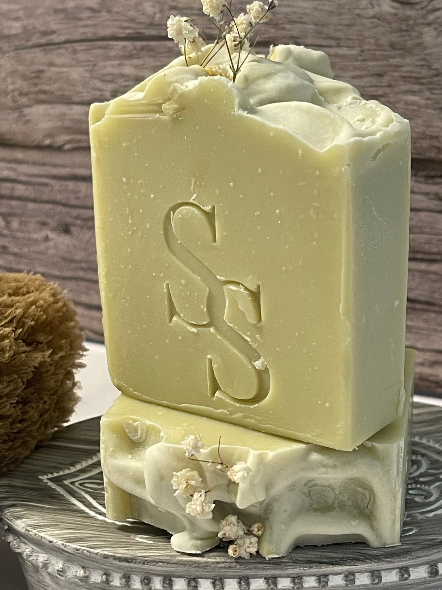 Bar of soap with a decorative design on a wooden surface