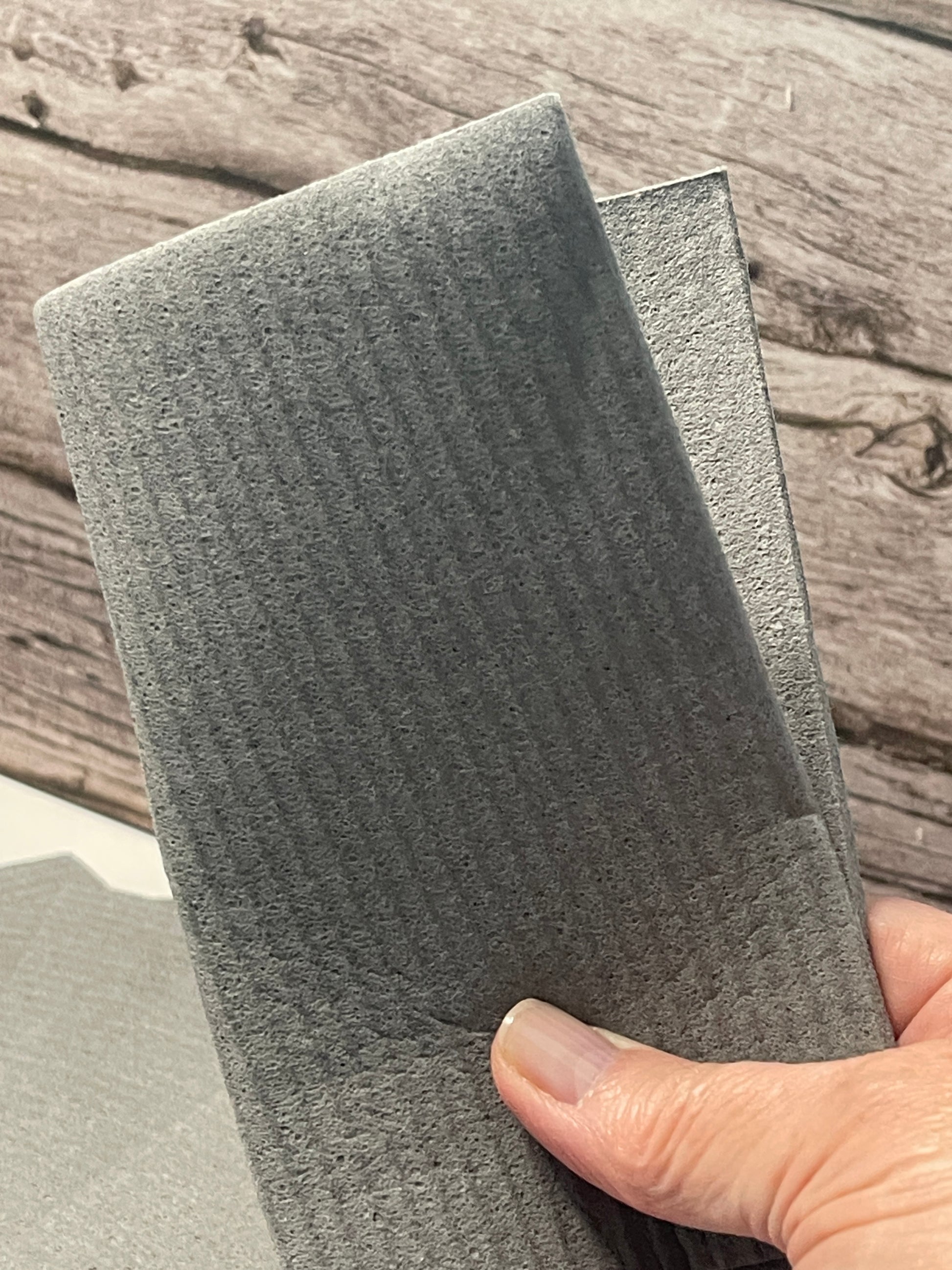 Hand holding a Swedish dish cloth