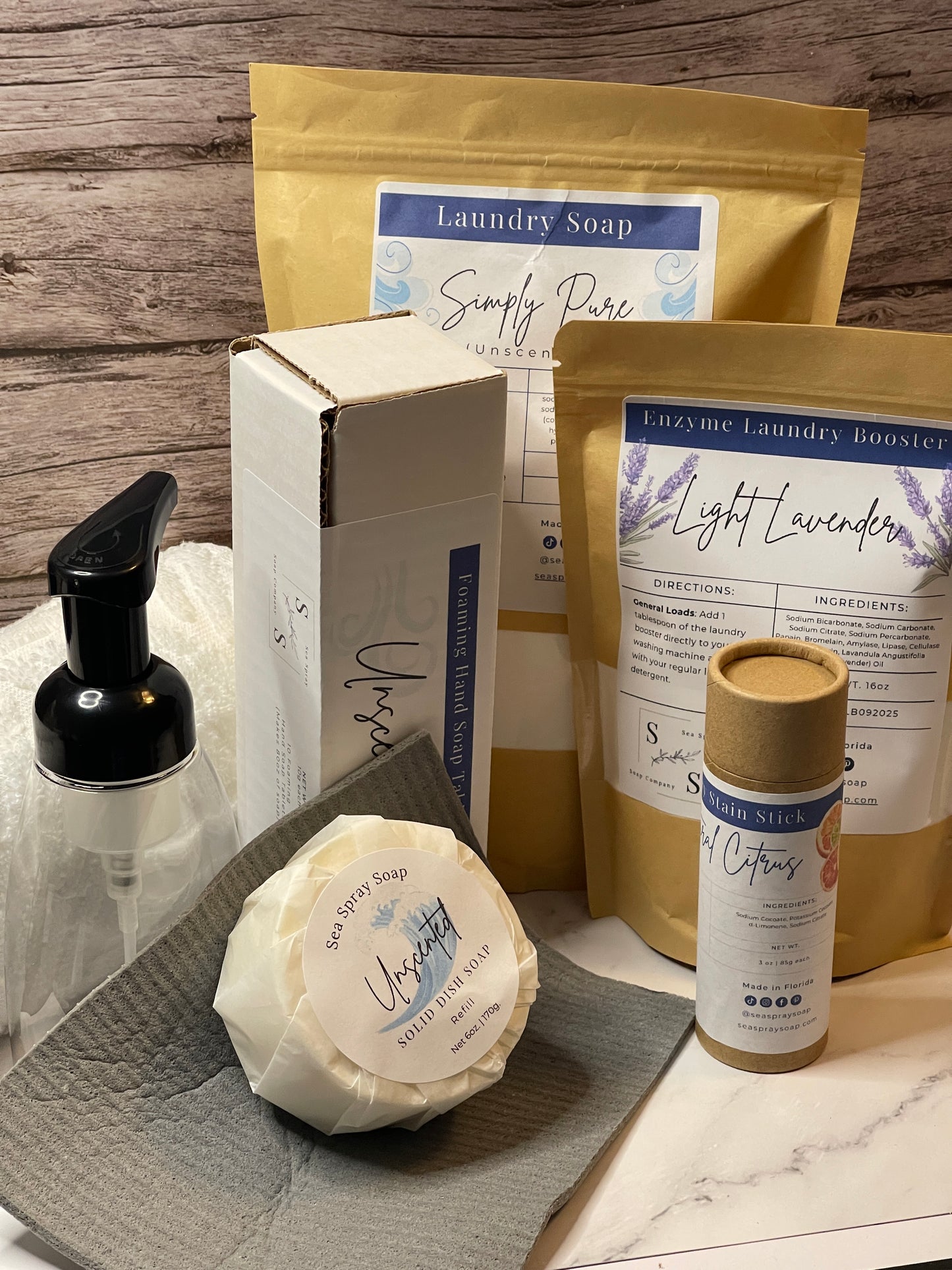 Collection of natural products including soap and packaging on a wooden surface