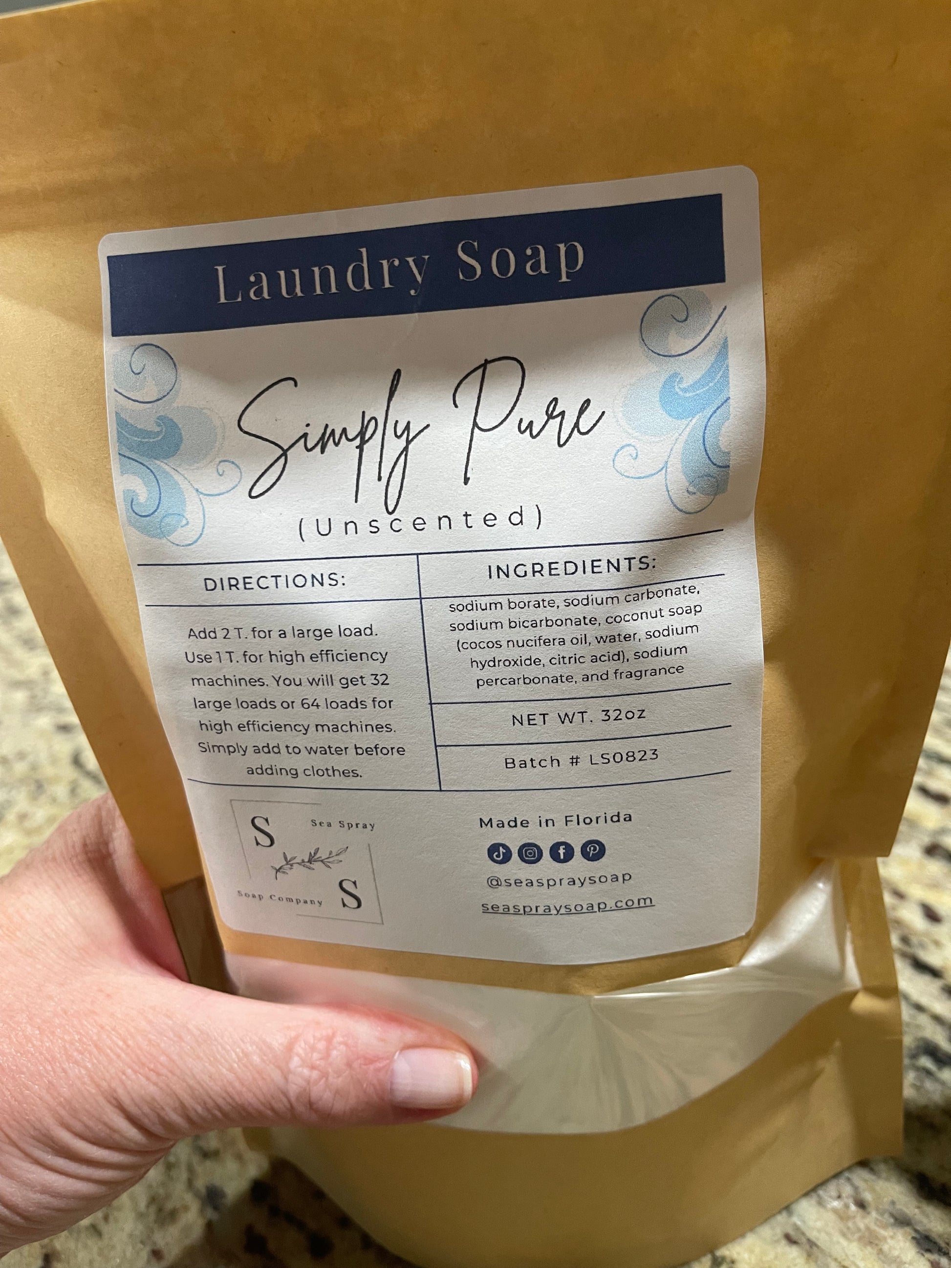 Hand holding natural unscented laundry soap