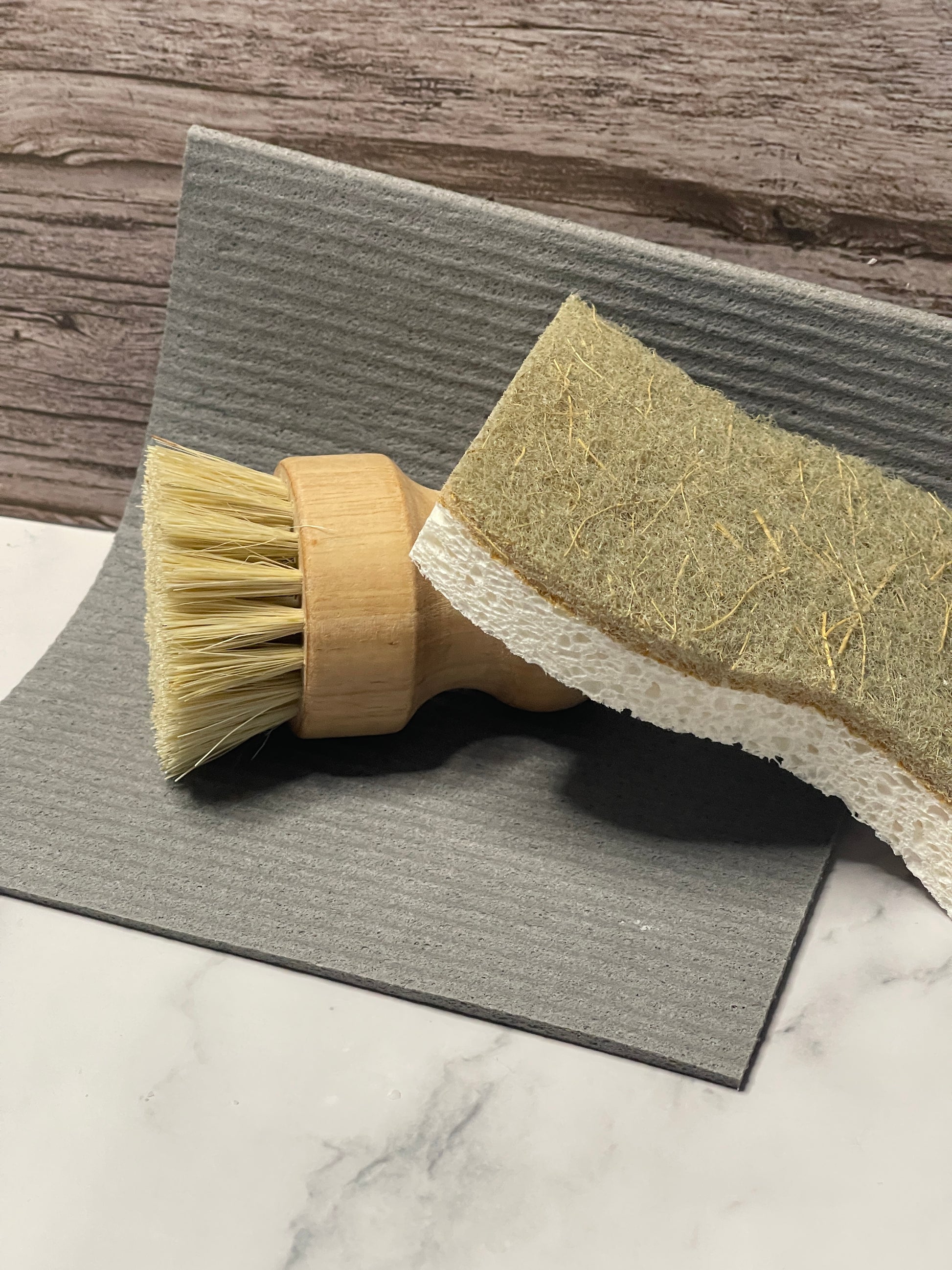 Cleaning brush with a scrubber head on a textured surface