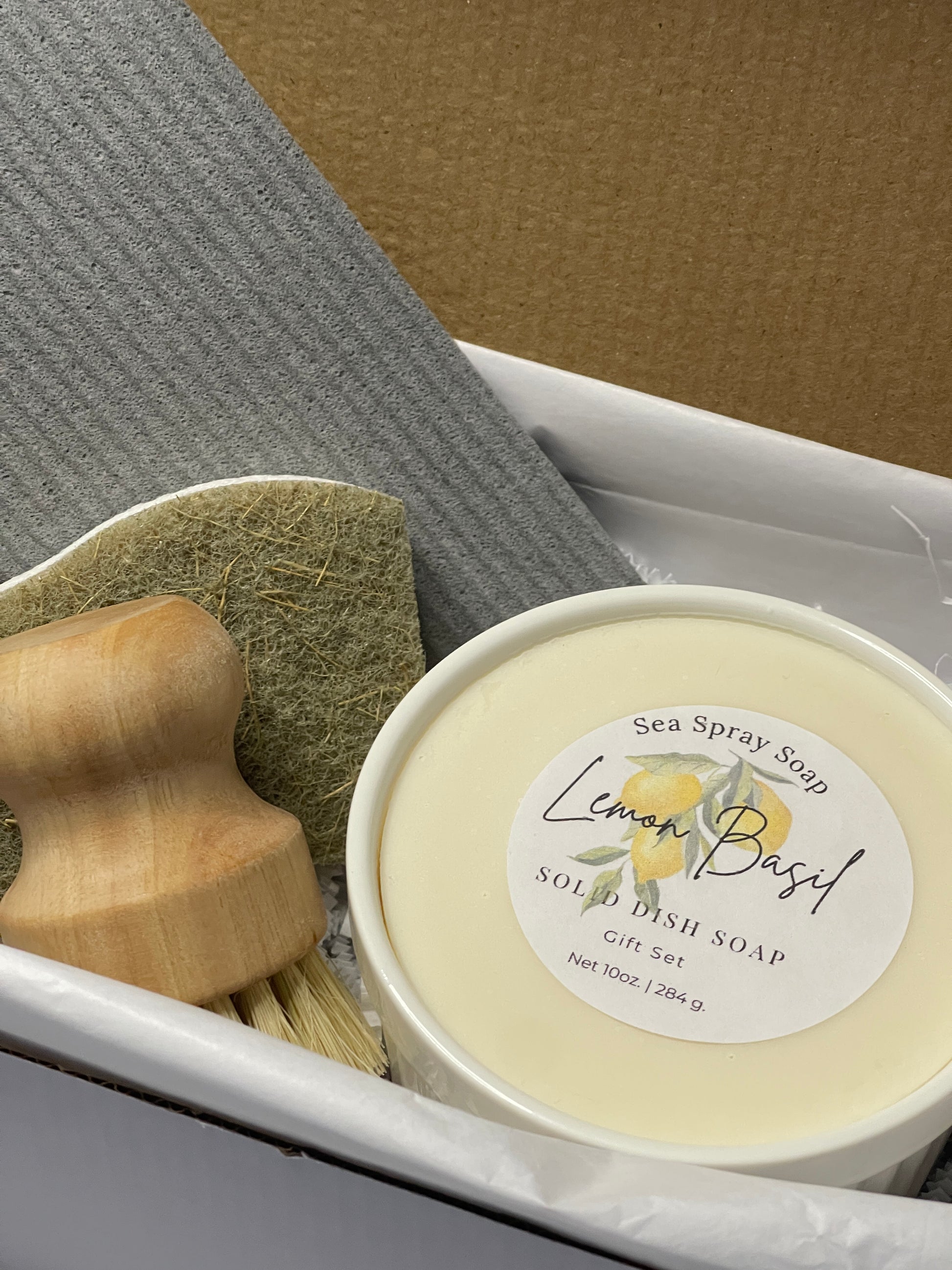 Bar of soap with a wooden spoon on a textured surface